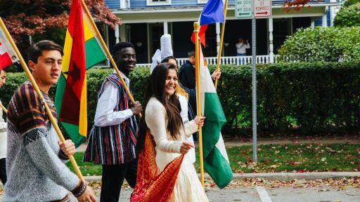 international students walking with national flags